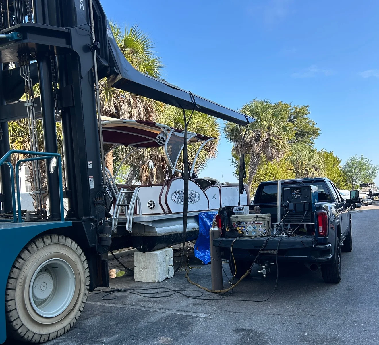 On Time Welding truck set up with welding equipment, cylinder and hoses at a marine jobsite